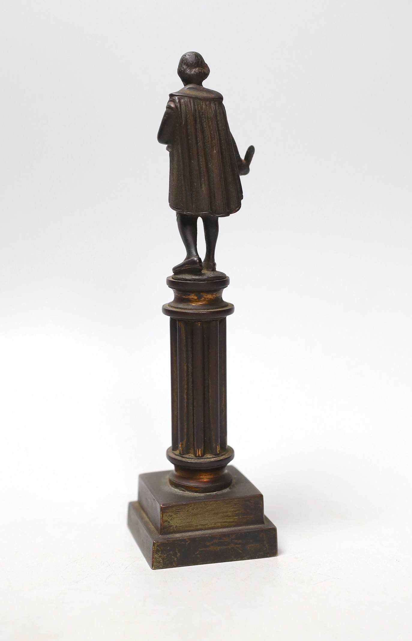 A late Victorian bronze figure of Shakespeare standing upon a column, 20cms high